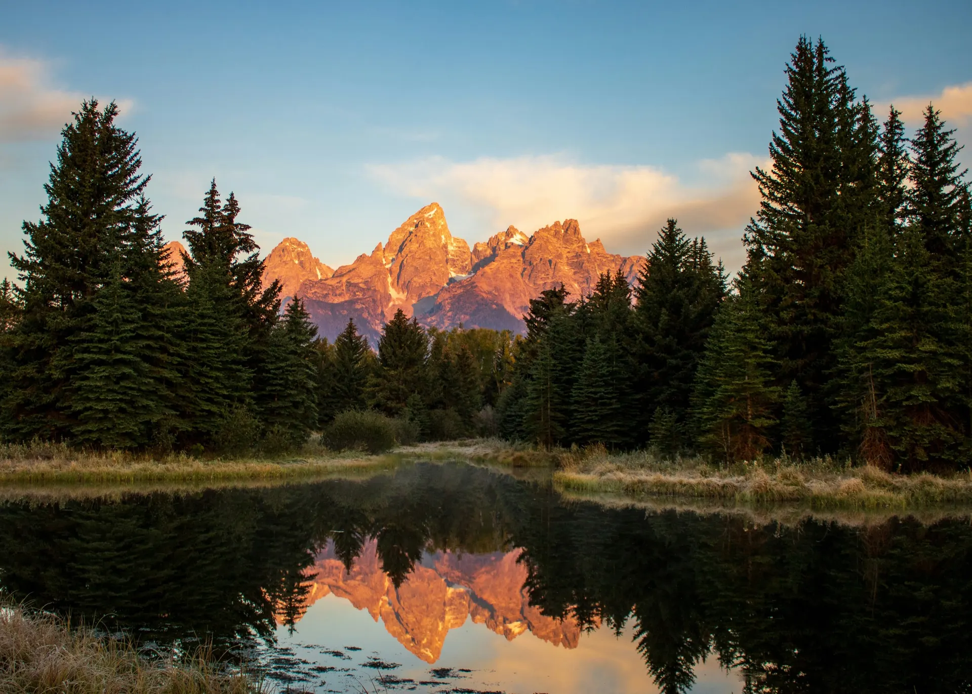 Teton mountains reflected in water north of Rock Springs